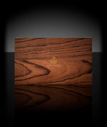 Natural brown wooden box containing Ameenah’s Oriental Collection perfumes , Musk, Amber, Oud, and Rose.