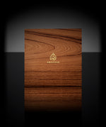 Close-up of the Prestige Gift Set wooden box with two Ameenah perfume bottles placed inside a black velvet interior.