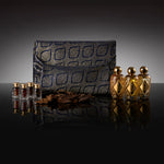 A three-slot Prestige Gift Set wooden box containing Ameenah perfumes and oud oils displayed on a dark velvet base.